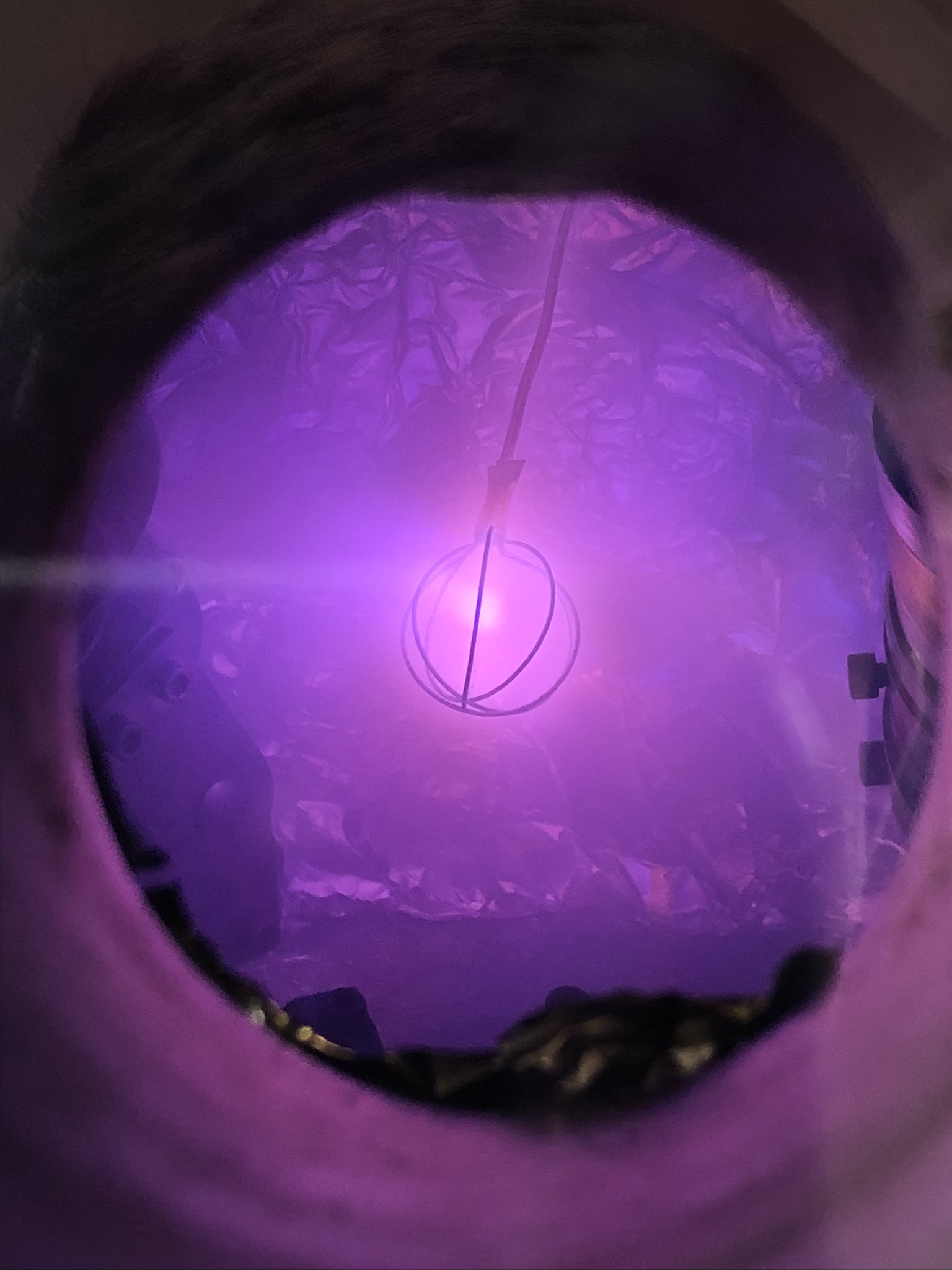 Full fusor experiment with its vacuum chamber, pumping system, instrumentation rack, and gas supply