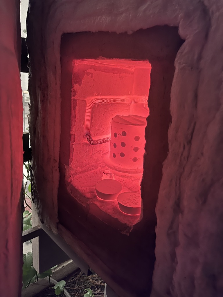 Cooking investment flask in kiln